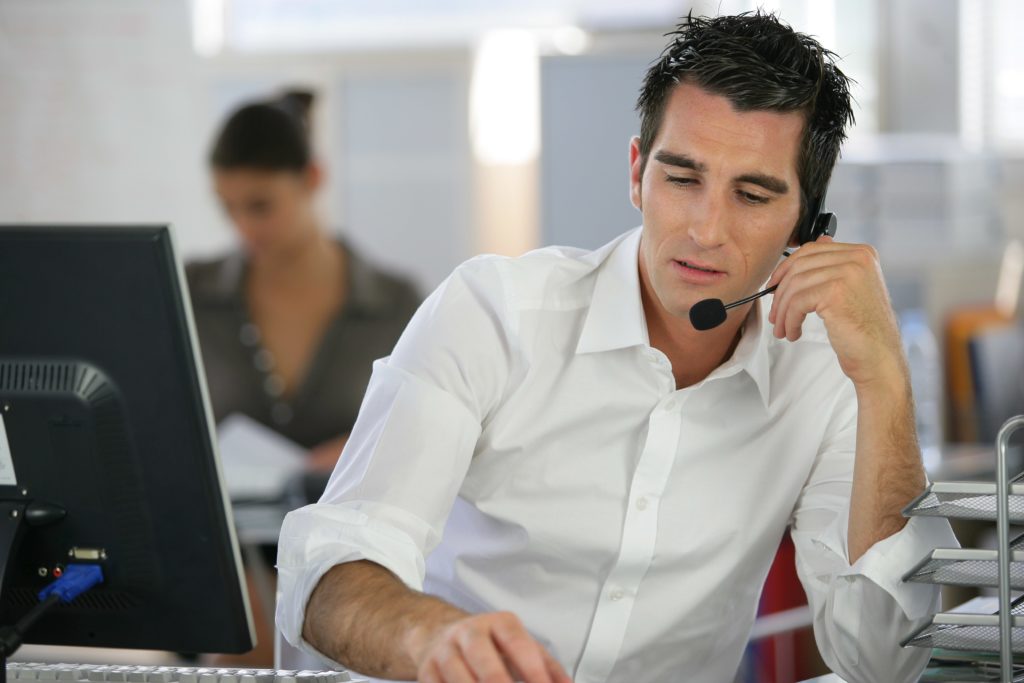 Call centre agent helping a customer.