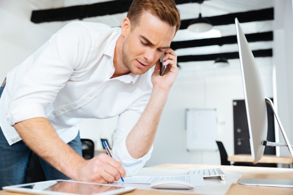 Inside salesman writing notes.